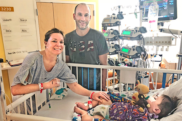 Baby Lockett in a hospital bed after receiving a kidney transplant from his mom