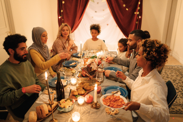 Seven people happily gathered for Thanksgiving dinner.