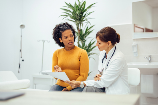 Concerned patient speaking with doctor.