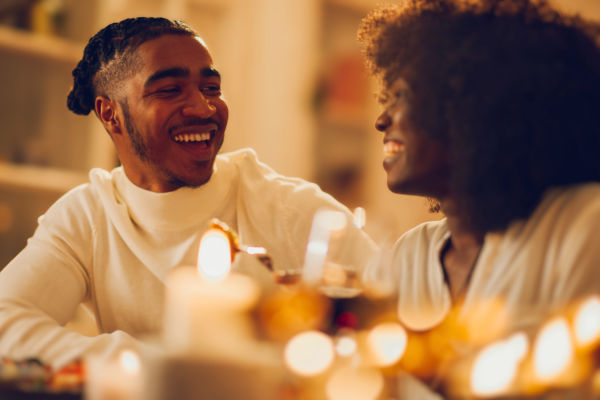 Couple happily enjoying candlelight dinner