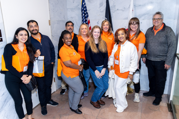 Group on NKF advocates posing with congress aid