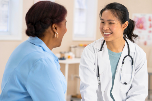 Doctor speaking with patient in office