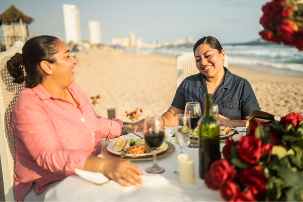 Couple enjoying romantic dinner on beach
