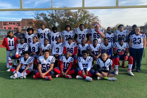 Calvin (coach on the far left) and football team