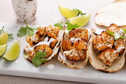 Spicy Roasted Cauliflower Tacos with Cilantro Lime Crema