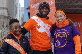 A kidney donor and a kidney recipient posing together at a Kidney Walk