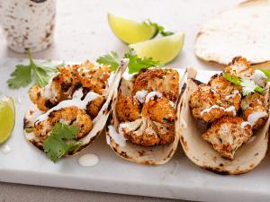Spicy Roasted Cauliflower Tacos with Cilantro Lime Crema