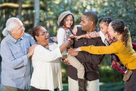 Family laughing together outside