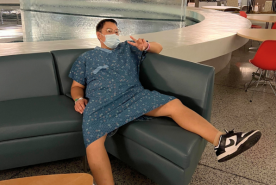 Randy Yim in hospital showing off his shoes