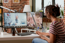 Patient at home speaking with doctor over computer.