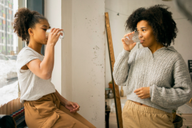 Parent and child drinking water