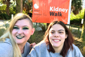 Daylina (L) and Alese (R) next to Kidney Walk banner