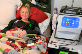 Comfy person in bed receiving home hemodialysis