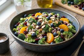 Broccoli salad with fresh blueberries, mandarin oranges, dried cranberries, and sliced almonds