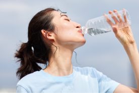 Sweaty person drinking water