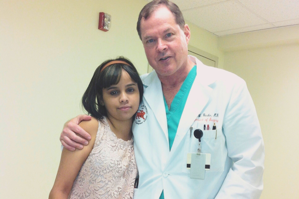 Young Yessie with her doctor