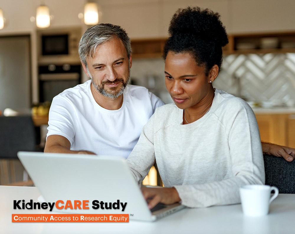 Couple looking at a laptop in the kitchen, KidneyCARE Study Logo