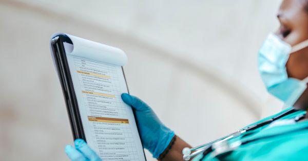 Healthcare provider looking at paperwork