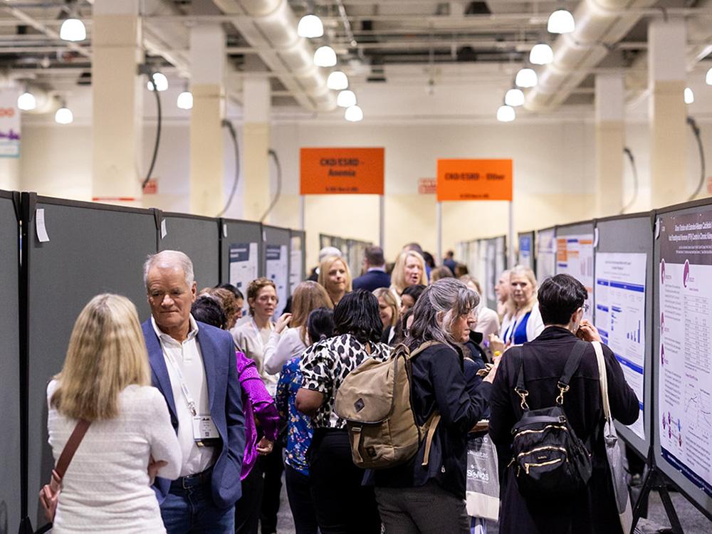 Crowd of people mingling in a row of abstract posters