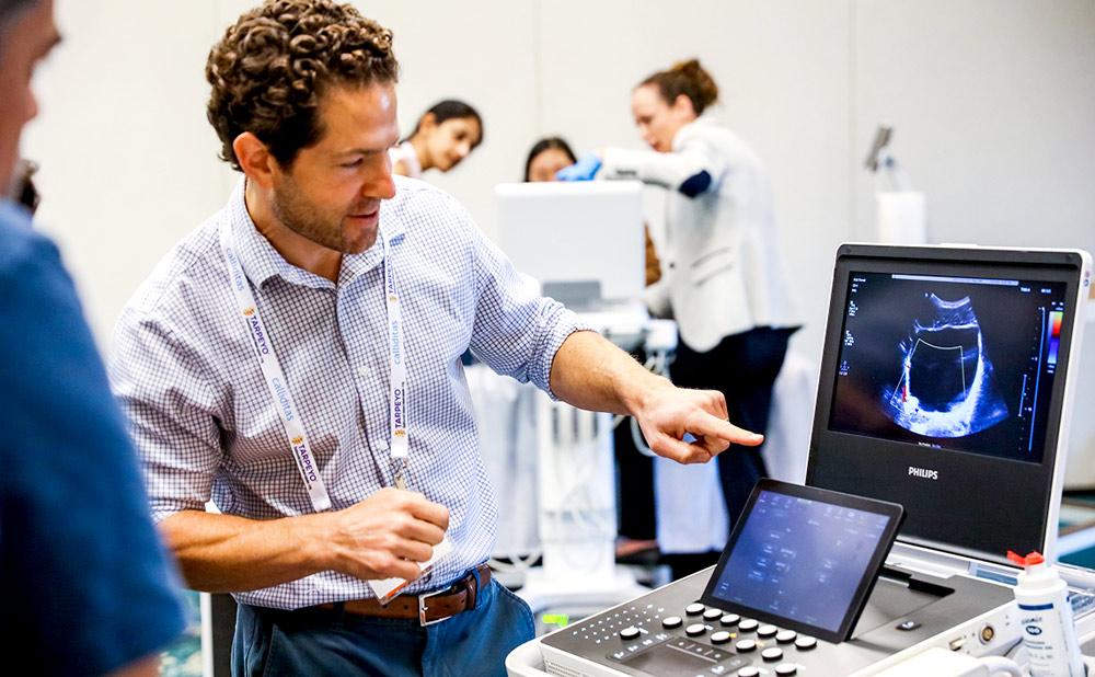 Professionals looking at equipment during a workshop