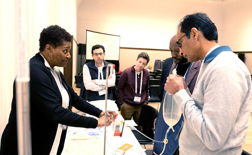 Professionals looking at equipment during a workshop