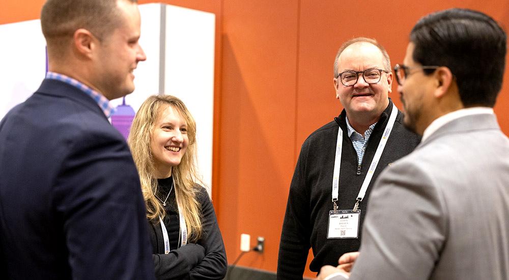 Professionals chatting at SCM