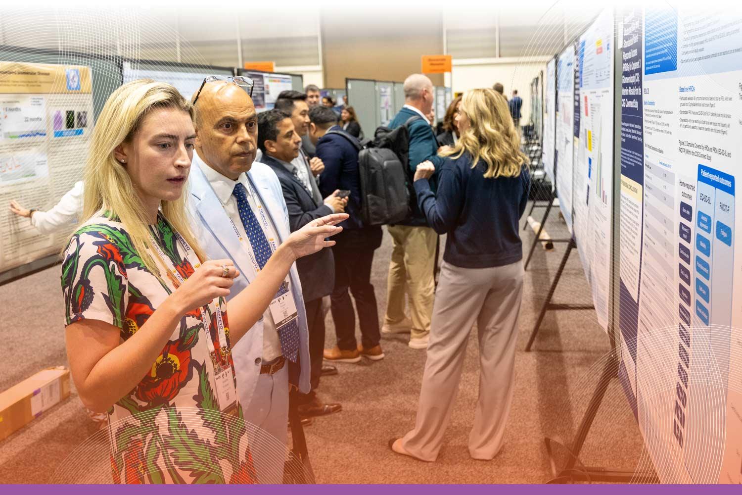 SCM attendees perusing the abstracts on display