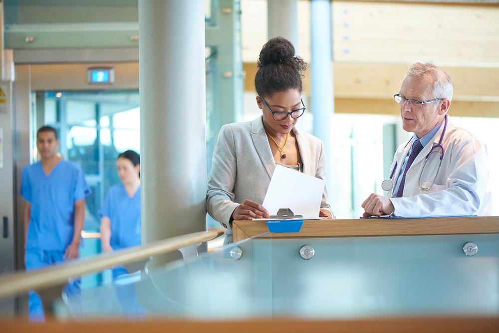 Doctors reviewing a chart in a hospital setting