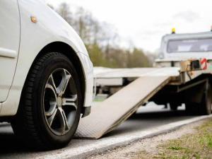 Car on tow truck for donation