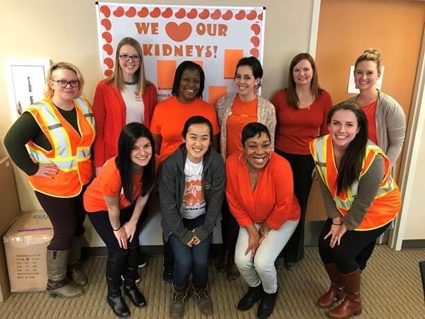 NKF staff in Michigan office posing in front of a sign that says “We heart our kidneys!”