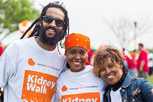 Three Kidney Walk participants smiling at a Walk event