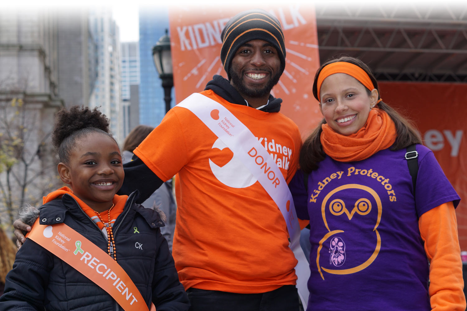 Kidney transplant recipient and kidney donor posing at an NKF event