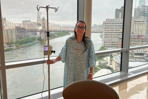 Tatiana in the hospital with an IV pole