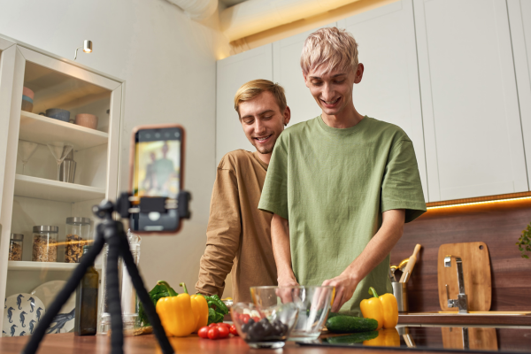 Couple filming a cooking tutorial